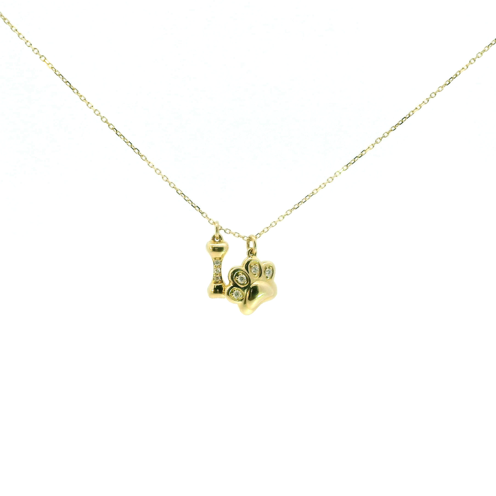 Lady's Yellow 14 Karat Pendant .05ctw diamond dog paw and bone on 18" chain